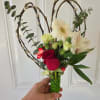 Handheld bouquet with red roses, white gerbera daisies, and alstroemeria