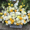 Large yellow and white floral basket arrangement