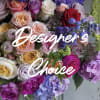 Mixed bouquet of roses and hydrangeas in pink, purple, and white