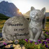 Cat memorial statue beside a stone reading "Forever in our Hearts"