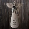 Glittery angel figurine holding a black flower with "A Mother's Love is forever" text