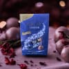 Box of Lindt Lindor dark chocolate truffles surrounded by wrapped chocolates