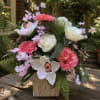 Bright pink dahlia-style blooms and soft white roses mingle with elegant white