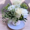 This adorable tea cup is made with Roses, carnations, queen Ann&rsquo;s lace