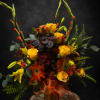 A tall, sculptural autumn bouquet that reads like a sunrise-rich yellow roses