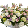 Large pastel flower basket with roses, hydrangeas, and white blooms