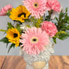 Bright, playful and impossible to miss, this Highland cow flower arrangement is