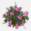 1 Dozen Purple Roses filled with eucalyptus and salal in a bouquet