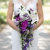 Make a breathtaking entrance with our Lavender Orchid Cascade Bridal Bouquet, a