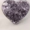 Heart-shaped crystal ornament with purple and clear stones