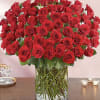 Large bouquet of red roses in a clear glass vase