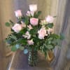 Half dozen (6) pink roses arranged with accent flower and a variety