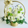 Heaven&rsquo;s Whisper is a serene blend of white hydrangeas, mums, roses, carnations