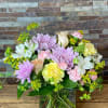 Mixed pastel bouquet in a square glass vase