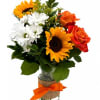 A sunny mix of sunflowers, orange roses, and white daisies in a