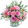 Pink roses and carnations in a clear glass vase
