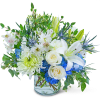 White lilies and roses with blue hydrangeas in a glass vase