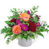 Bouquet of orange and red roses with purple daisies in a white vase