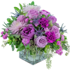 Lavender and purple mixed bouquet in a square glass vase