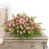 Pink carnations symbolize thoughts of remembrance, while pink roses are a sign