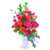 Tall bouquet of pink and orange roses in a white vase