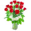Red roses arranged in a clear glass vase with white hydrangeas