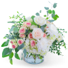 Pink and white roses with white blooms in a clear glass vase