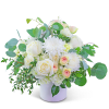 White roses and chrysanthemums in a white vase with green foliage