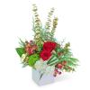 Red roses and white hydrangeas in a white box with mixed greenery