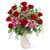 Bouquet of red roses and pink lilies in a white vase