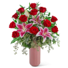 Red roses and pink lilies in a tall pink vase