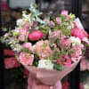 Pink and white mixed bouquet wrapped in pink paper