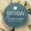 White flowers with a birthday premium label over the center