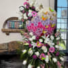 Celebrate a beautiful life with our Ombre heart-shaped standing spray. Featuring a