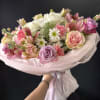 Blush Whisper Elegance is a voluminous, delicately balanced arrangement in shades of
