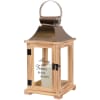 Wooden memorial lantern with a candle inside