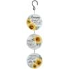 A spinner with three tiers, each decorated with golden sunflowers and a