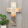 A decorative wall cross with a verse telling to have faith in