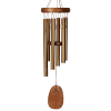 Wooden wind chime with gold metal tubes and a hanging wooden clapper