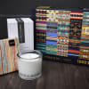 Candle, boxed candle, striped pouch, and a patterned puzzle box