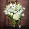 An outstanding bouquet of all white flowers is a lovely gift for