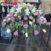The Sweet Memories Casket Spray offers a gentle and elegant farewell, celebrating