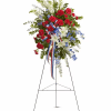 "Standing tall, proud and patriotic, this dazzling free-standing spray is like a