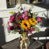 This country wildflower&ndash;inspired arrangement brings the charm of open fields and simple
