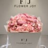 Pink rose and hydrangea bouquet in a white gift box with ribbon