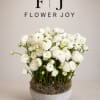 A clean and elegant arrangement of white ranunculus, featuring delicate layered petals