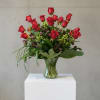 Bountiful roses with a variety of greens and floral accents.. a generous