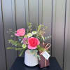 One of our handcrafted ceramic vases with a beautiful summer arrangement paired