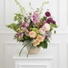 A lush and elegant floral display, filled with color and warmth in