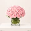 Pink roses arranged in a clear glass vase